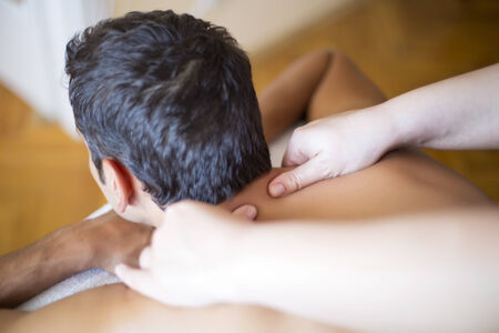 Young man having a massageの写真素材