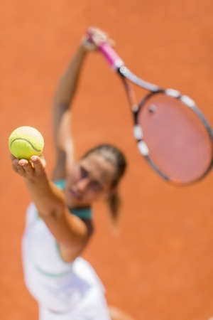 Young woman playing tennisの写真素材