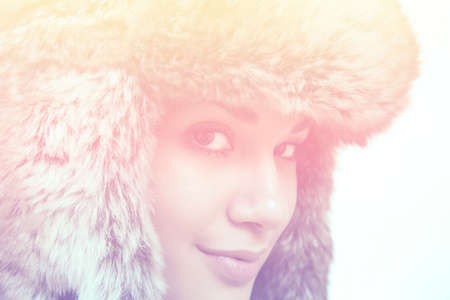 Young woman with winter capの写真素材