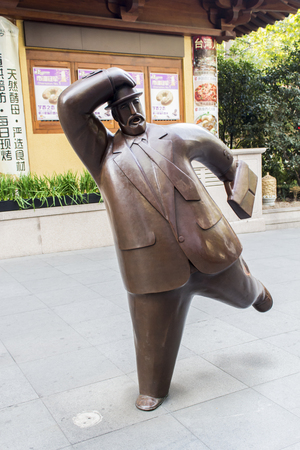 Man sculpture made of reinforced fiberglass in Shanghai, China at November 16, 2013. Sculpture is made by Wu Zhenwei Wu who has constructed more than 50 rotund gentlemenのeditorial素材