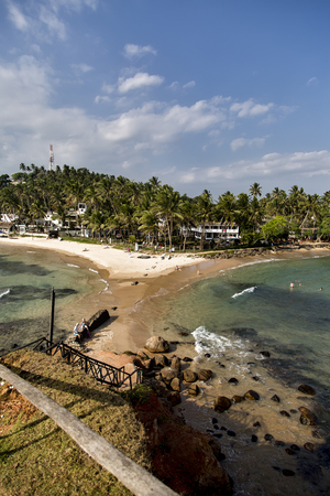 MIRISSA, SRI LANKA - JANUARY 24, 2014: Unidentified tourists at Mirissa beach in Sri Lanka. Mirissa Beach is rapidly becoming a popular surfer hangout during the months of November to March.のeditorial素材