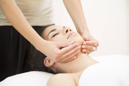 Young woman having a head massageの写真素材