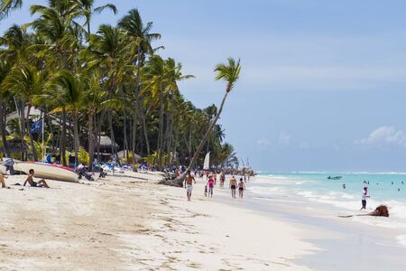 Bavaro, Dominican Republic - April 30, 2013: Unidentified tourists at the beach in Bavaro, Dominican Republic. Bavaro was developed together with the tourist region of Punta Cana, as a town for resort workersのeditorial素材