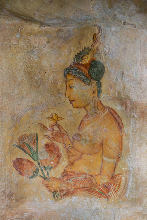 MATALE, SRI LANKA- JANUARY 28, 2014: Frescoe of the woman at Sigiriya Rock Fortress at Matale. Sigiriya today is a UNESCO listed World Heritage Site and most visited historic site in Sri Lanka.のeditorial素材