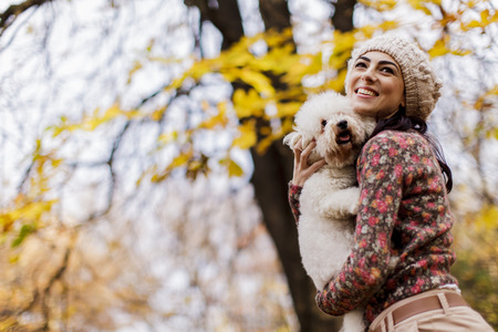 Young woman with a cute dogの写真素材