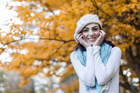 Young woman at autumn forestの写真素材