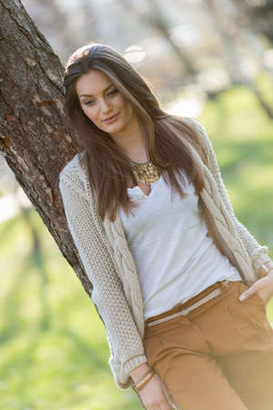 Pretty young woman in the parkの写真素材