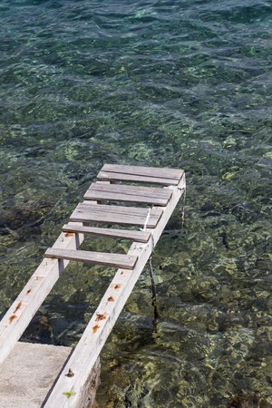 Old wooden pier at Adriatic seaの写真素材