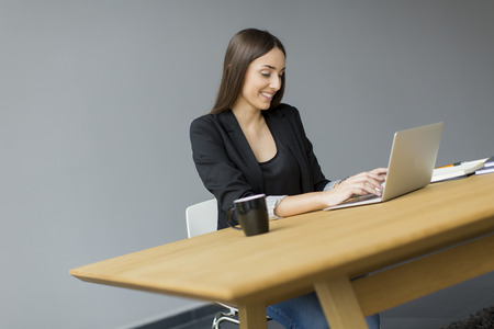 Young woman in the officeの写真素材