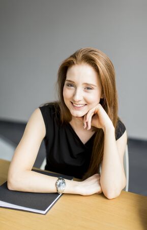 Young woman in the officeの写真素材