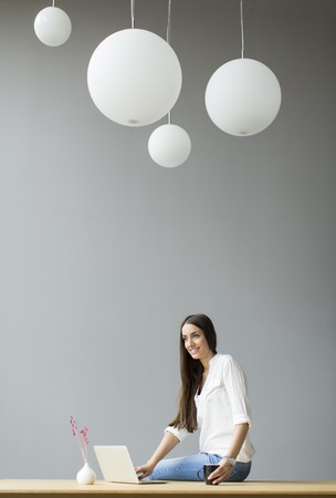 Young woman working in the officeの写真素材