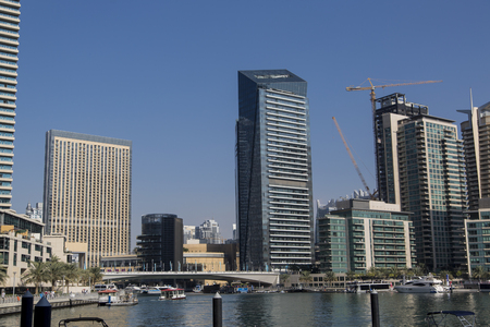 DUBAI, UAE - JANUARY 16, 2014: View at modern skyscrapers in Dubai Marina in Dubai, UAE. When the entire development is complete, it will accommodate more than 120,000 people.のeditorial素材