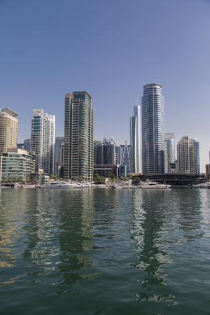 DUBAI, UAE - JANUARY 16, 2014: View at modern skyscrapers in Dubai Marina in Dubai, UAE. When the entire development is complete, it will accommodate more than 120,000 people.のeditorial素材