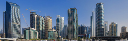 DUBAI, UAE - JANUARY 16, 2014: View at modern skyscrapers in Dubai Marina in Dubai, UAE. When the entire development is complete, it will accommodate more than 120,000 people.のeditorial素材