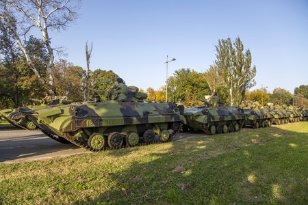 BELGRADE, SERBIA, OCTOBER 10, 2014: Unidentified serbian soldiers in BVP M-80A Infantry Fighting Vehicles of the Serbian Armed Forces. Soldiers are preparing  for military parade marking the 70th anniversary of the liberation of Belgrade in WWII.のeditorial素材