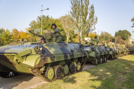 BELGRADE, SERBIA, OCTOBER 10, 2014: Unidentified serbian soldiers in BVP M-80A Infantry Fighting Vehicles of the Serbian Armed Forces. Soldiers are preparing  for military parade marking the 70th anniversary of the liberation of Belgrade in WWII.のeditorial素材