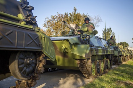 BELGRADE, SERBIA, OCTOBER 10, 2014: Unidentified serbian soldiers in BVP M-80A Infantry Fighting Vehicles of the Serbian Armed Forces. Soldiers are preparing  for military parade marking the 70th anniversary of the liberation of Belgrade in WWII.のeditorial素材