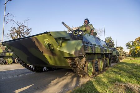 BELGRADE, SERBIA, OCTOBER 10, 2014: Unidentified serbian soldiers in BVP M-80A Infantry Fighting Vehicles of the Serbian Armed Forces. Soldiers are preparing  for military parade marking the 70th anniversary of the liberation of Belgrade in WWII.のeditorial素材