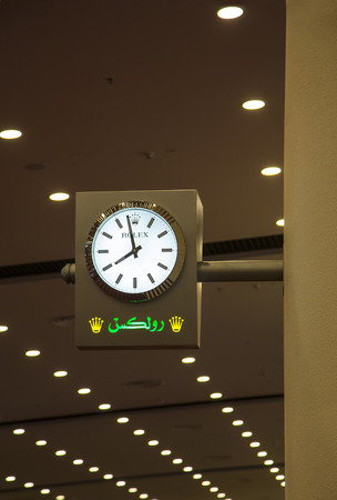 DUBAI, UAE - JANUARY 29, 2014: Rolex clock at Dubai Airport. This Rolex sponsored clocks are part of a groundbreaking worldwide partnership with Dubai Airport.のeditorial素材