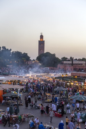 MARRAKESH, MOROCCO - SEPTEMBER 11, 2014: Unidentified people at Jeema el Fna in Marrakesh, Morocco. Jeema el Fna received UNESCO label of Masterpieces of the Oral and Intangible Heritage of Humanity.のeditorial素材
