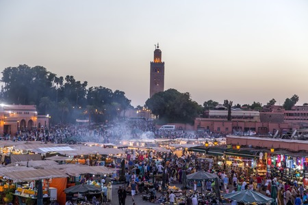 MARRAKESH, MOROCCO - SEPTEMBER 11, 2014: Unidentified people at Jeema el Fna in Marrakesh, Morocco. Jeema el Fna received UNESCO label of Masterpieces of the Oral and Intangible Heritage of Humanity.のeditorial素材