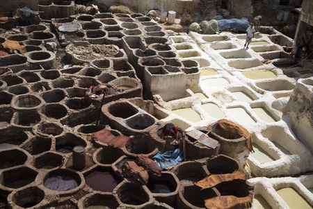 FES, MOROCCO - SEPTEMBER 15, 2014: Unidentified people working at tannery in Fes, Morocco. This is the oldest leather tannery in the world and has not changed since the 11th century.のeditorial素材