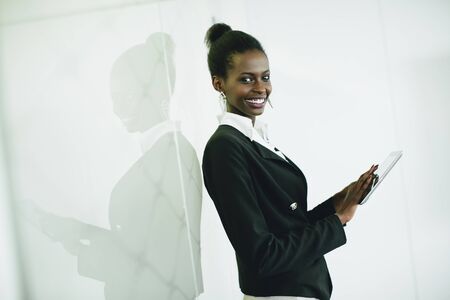 Young african woman with tablet in the officeの写真素材