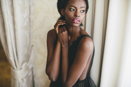 Young black woman in the roomの写真素材