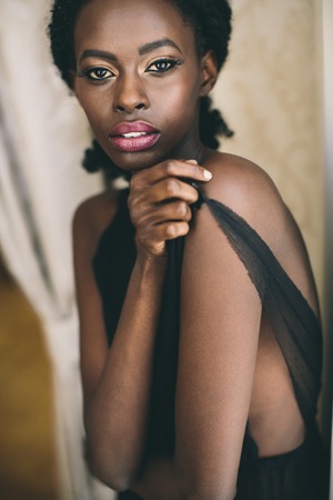 Young black woman in the roomの写真素材