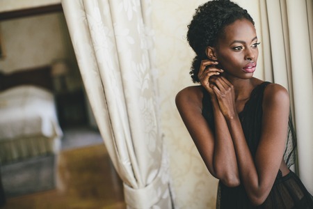 Young black woman in the roomの写真素材