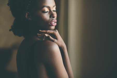 Young black woman in the roomの写真素材