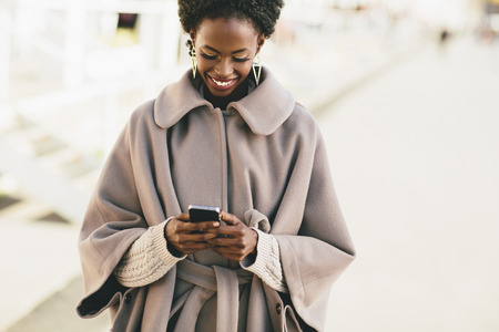 Young black woman on the streetの写真素材