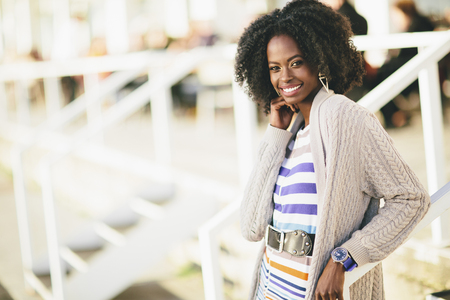 Young black woman on the streetの写真素材