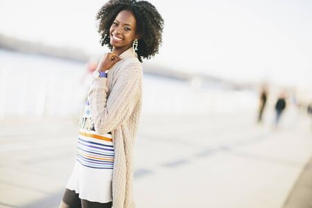 Young black woman on the streetの写真素材