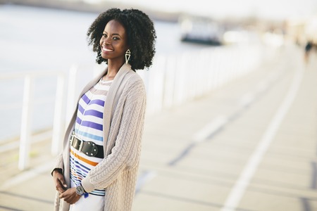Young black woman on the streetの写真素材