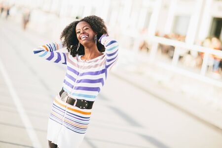 Young black woman on the streetの写真素材