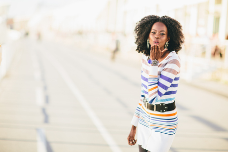 Young black woman on the streetの写真素材