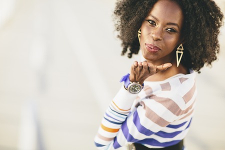 Young black woman on the streetの写真素材