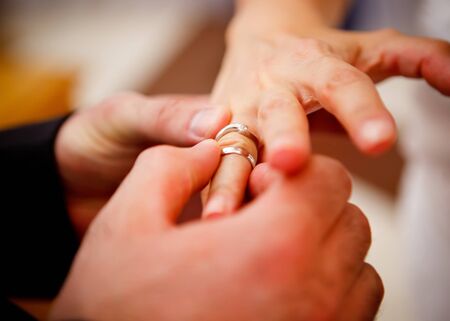 Bride and groom with wedding ringsの写真素材