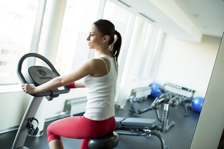 Young woman training in the gymの写真素材