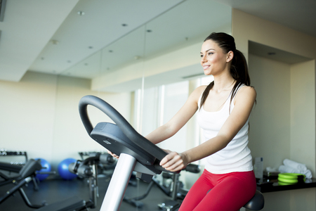 Young woman training in the gymの写真素材