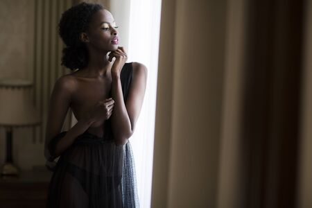 Young black woman in the roomの写真素材