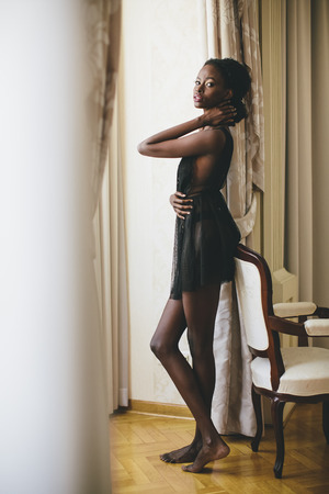 Young black woman in the roomの写真素材