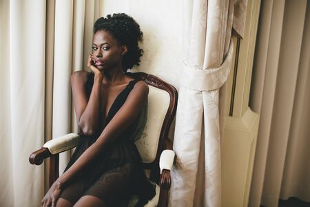 Young black woman in the roomの写真素材