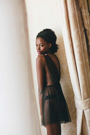 Young black woman in the roomの写真素材