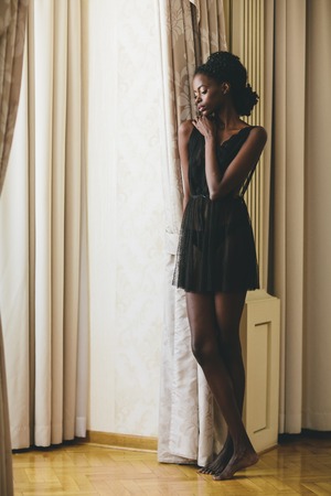 Young black woman in the roomの写真素材