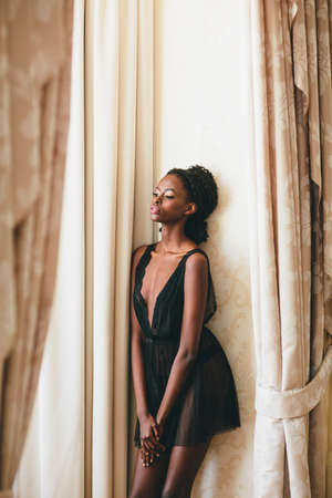 Young black woman in the roomの写真素材