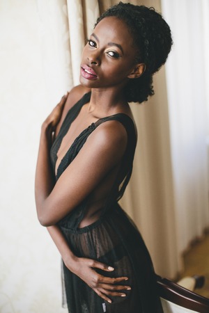 Young black woman in the roomの写真素材
