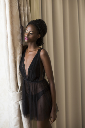 Young black woman in the roomの写真素材