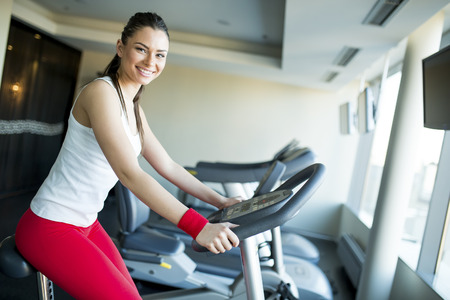 Young woman training in the gymの写真素材